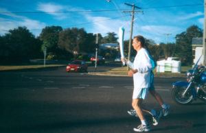 Olympic torch bearer on Brisbane Road, Booval, Ipswich, 2000 - Image Courtesy of Picture Ipswich